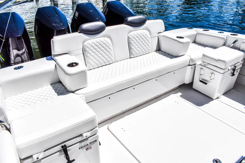 Water Bird Yacht Photos Pics Luxurious seating on 2025 HCB 42 Lujo boat with quilted upholstery and cup holders.