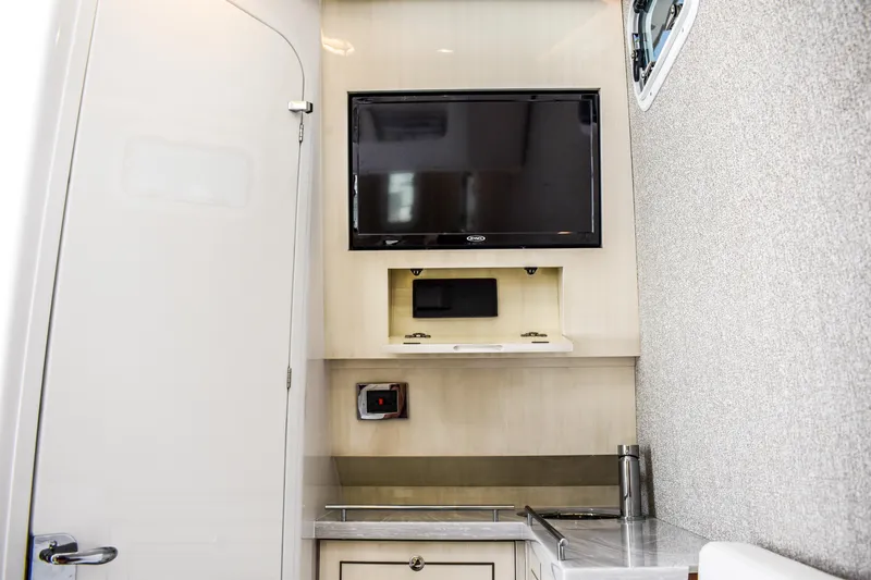 Water Bird Yacht Photos Pics Interior of 2025 HCB 42 Lujo featuring a mounted TV and sleek cabinetry.