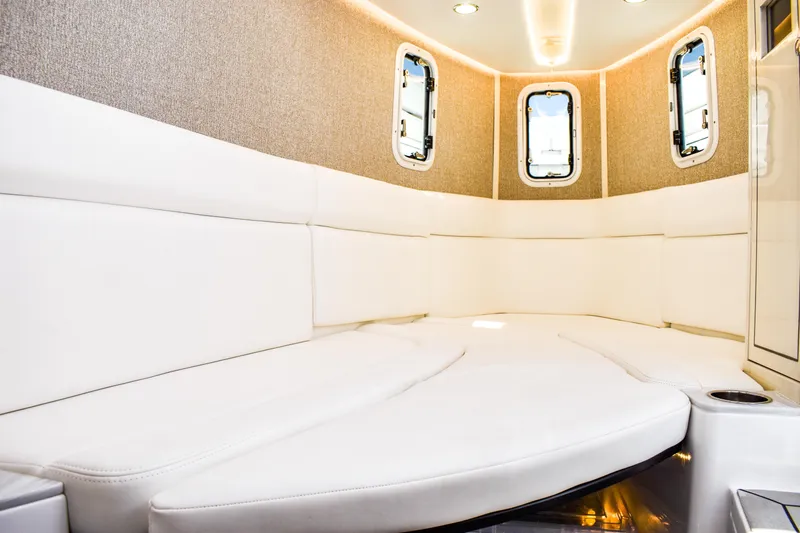 Water Bird Yacht Photos Pics Luxurious interior of 2025 HCB 42 Lujo boat with plush white seating.