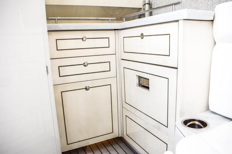 Water Bird Yacht Photos Pics Luxurious interior cabinetry of 2025 HCB 42 Lujo boat, featuring sleek white drawers and modern design.