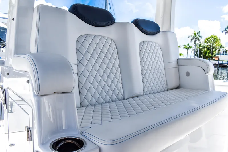 Water Bird Yacht Photos Pics Luxurious seating on 2025 HCB 42 Lujo boat with quilted upholstery and armrests.