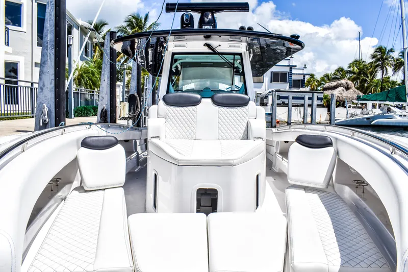 Water Bird Yacht Photos Pics Luxurious 2025 HCB 42 Lujo boat interior with white seating and modern design.