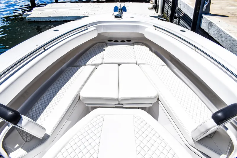 Water Bird Yacht Photos Pics 2025 HCB 42 Lujo boat interior with luxurious white seating and diamond-patterned upholstery.
