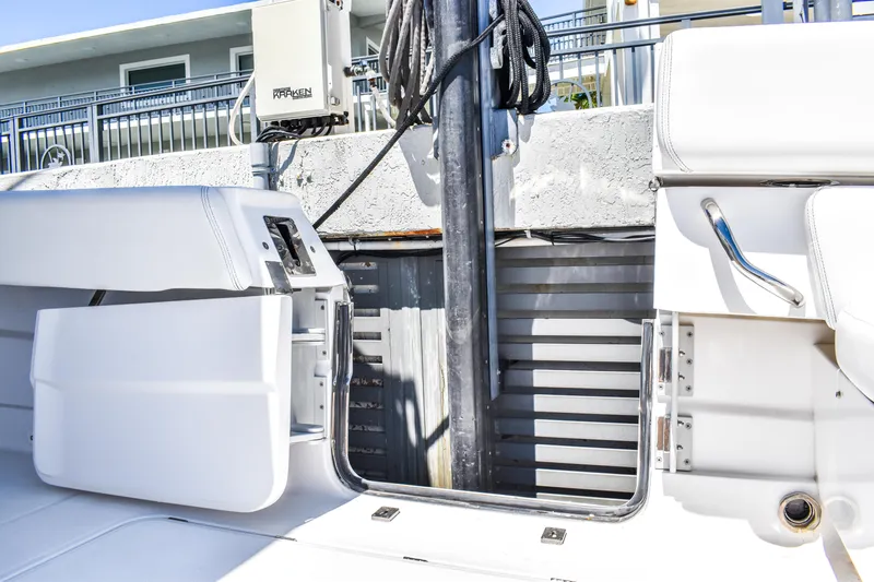 Water Bird Yacht Photos Pics 2025 HCB 42 Lujo boat with open side door, docked at marina.