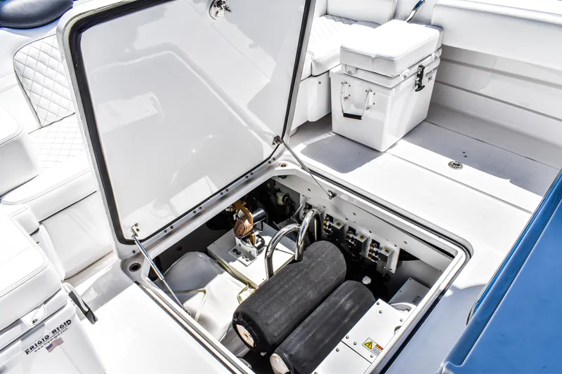 Water Bird Yacht Photos Pics Open hatch of 2025 HCB 42 Lujo boat showing interior storage and equipment.