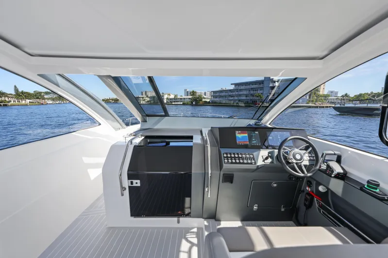 Yacht Photos Pics Interior view of 2025 Valiatt 380 Bowrider boat, featuring modern dashboard and steering.