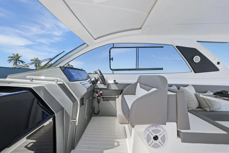  Yacht Photos Pics 2025 Valiatt 380 Bowrider interior with modern helm, seating, and tropical backdrop.