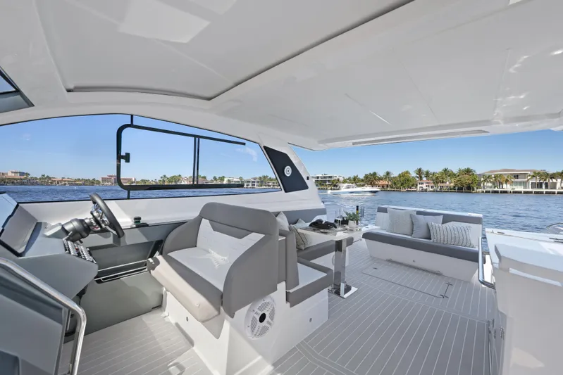 Yacht Photos Pics 2025 Valiatt 380 Bowrider interior with modern seating and scenic waterfront view.