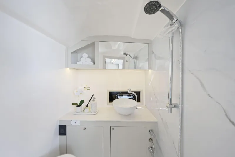  Yacht Photos Pics Luxurious bathroom in 2025 Valiatt 380 Bowrider boat with modern fixtures and elegant design.