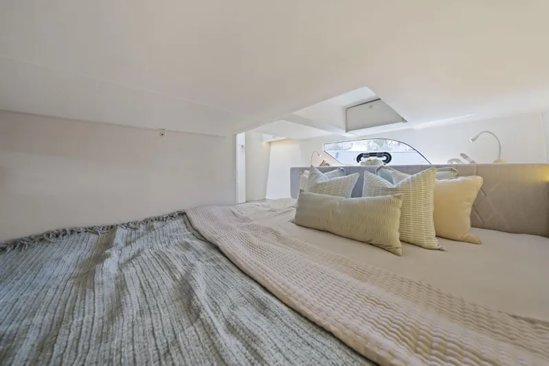  Yacht Photos Pics Luxurious cabin interior of 2025 Valiatt 380 Bowrider with cozy bedding and pillows.