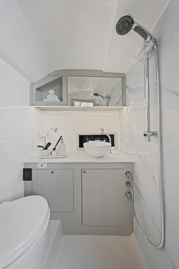  Yacht Photos Pics Modern bathroom in 2025 Valiatt 380 Bowrider boat, featuring sleek fixtures and elegant design.