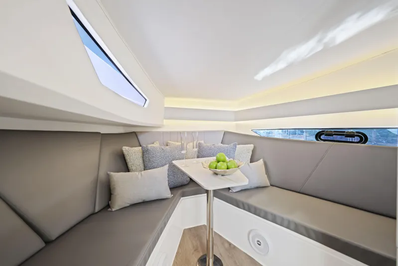  Yacht Photos Pics Luxurious interior of 2025 Valiatt 380 Bowrider with elegant seating and table.