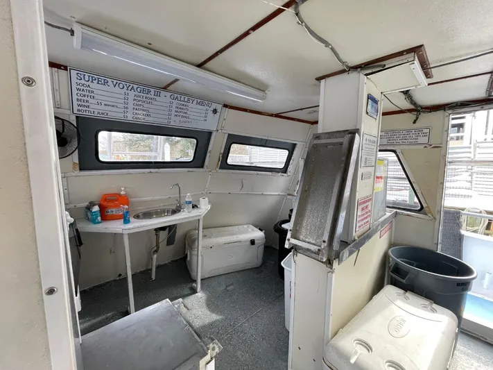 Super Voyager III Yacht Photos Pics Interior of 1972 Swiftships Commercial Passenger vessel with galley area and menu board.