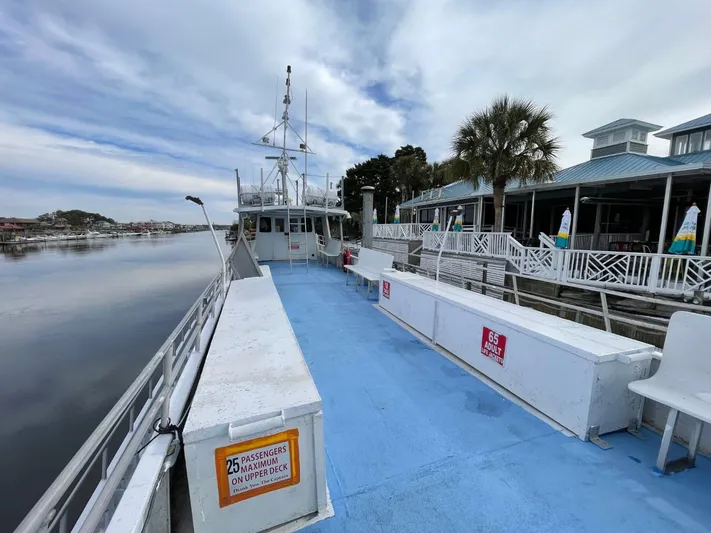 Super Voyager III Yacht Photos Pics 1972 Swiftships commercial passenger boat docked, blue deck, white railings, calm waterfront view.