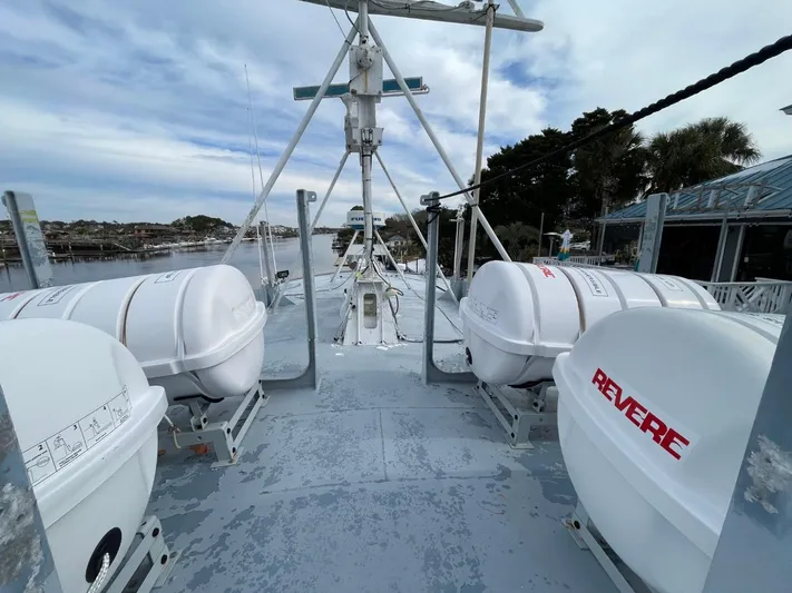 Super Voyager III Yacht Photos Pics 1972 Swiftships Commercial Passenger vessel deck with lifeboats and scenic waterfront view.