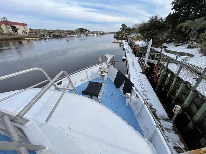 Super Voyager III Yacht Photos Pics 1972 Swiftships Commercial Passenger boat docked on a serene river.