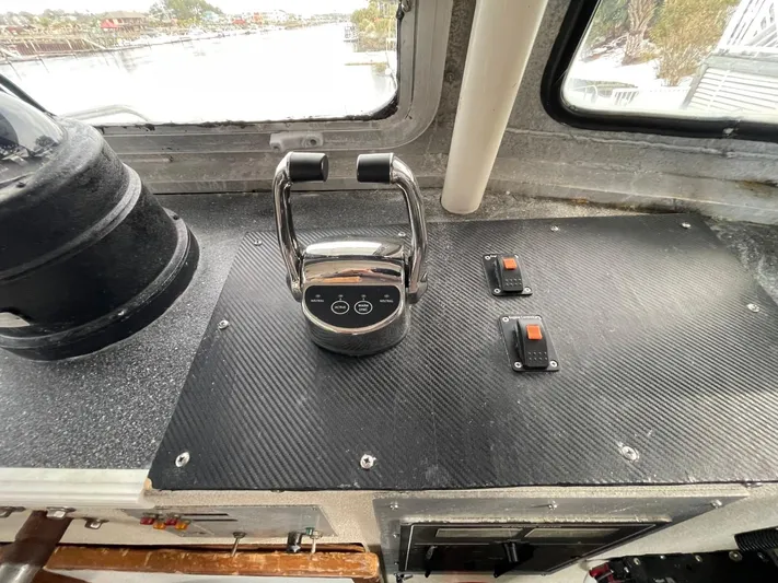 Super Voyager III Yacht Photos Pics Control panel of a 1972 Swiftships Commercial Passenger vessel, featuring throttle and switches.