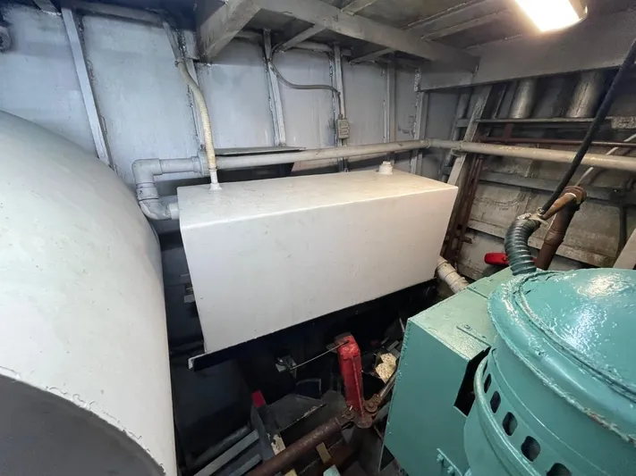 Super Voyager III Yacht Photos Pics Engine room of a 1972 Swiftships commercial passenger vessel, featuring machinery and equipment.