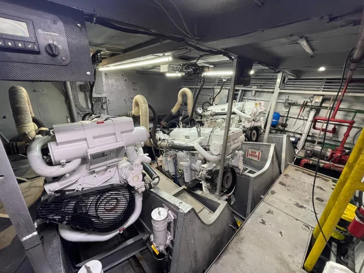 Super Voyager III Yacht Photos Pics Engine room of a 1972 Swiftships Commercial Passenger vessel, featuring dual engines and mechanical components.