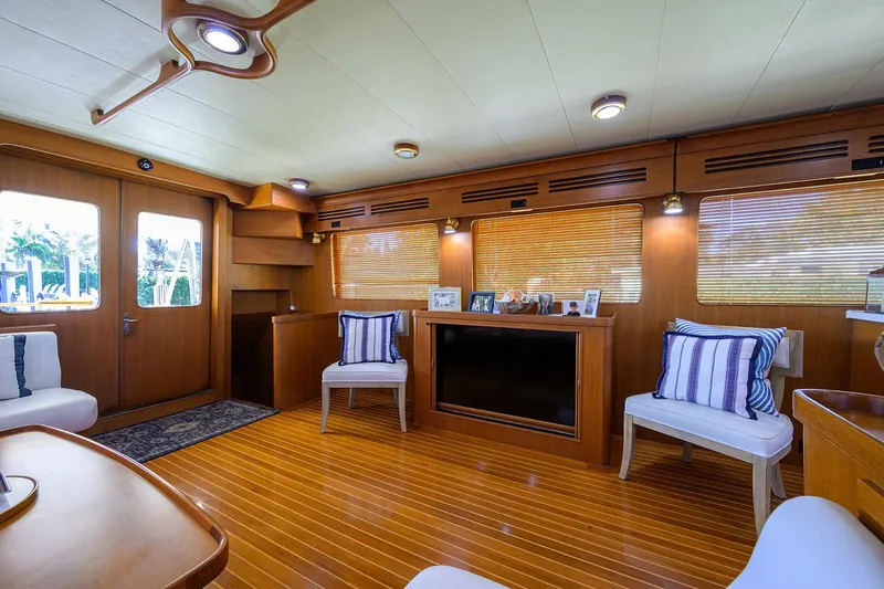 Bandol Yacht Photos Pics Luxurious Marlow 78E yacht interior with wood paneling and striped cushions, 2006 model.