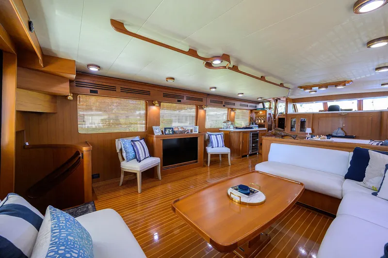 Bandol Yacht Photos Pics Luxurious interior of 2006 Marlow 78E yacht with elegant wood finishes and plush seating.