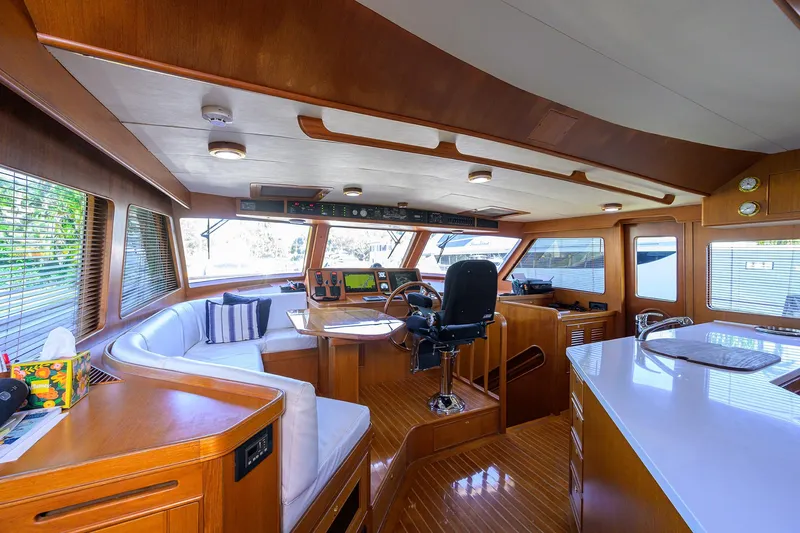 Bandol Yacht Photos Pics Luxurious interior of a 2006 Marlow 78E yacht with wood finishes and modern amenities.