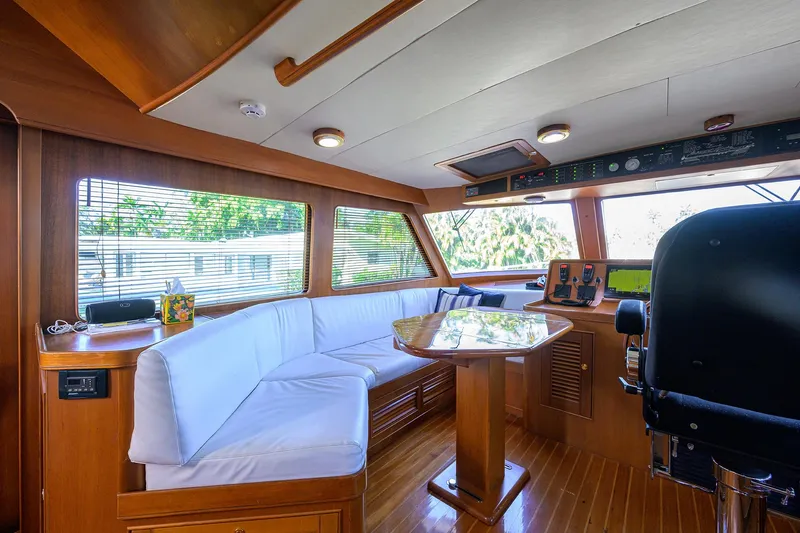 Bandol Yacht Photos Pics Luxurious interior of a 2006 Marlow 78E yacht with plush seating and navigation controls.