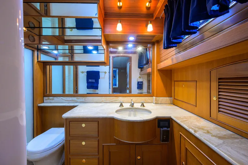 Bandol Yacht Photos Pics Luxurious Marlow 78E 2006 yacht bathroom with wood cabinetry and elegant lighting.
