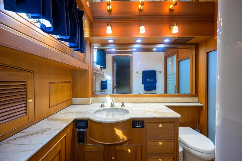 Bandol Yacht Photos Pics Luxurious Marlow 78E 2006 yacht bathroom with wood cabinetry and elegant lighting.