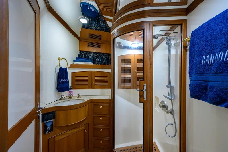 Bandol Yacht Photos Pics Luxurious Marlow 78E 2006 yacht bathroom with wood accents and modern shower.