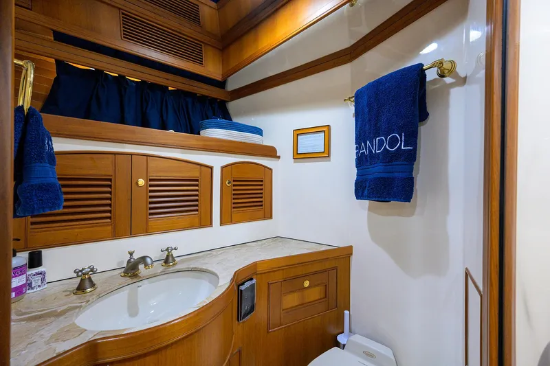 Bandol Yacht Photos Pics Luxurious Marlow 78E yacht bathroom with wooden cabinetry and elegant fixtures, 2006 model.
