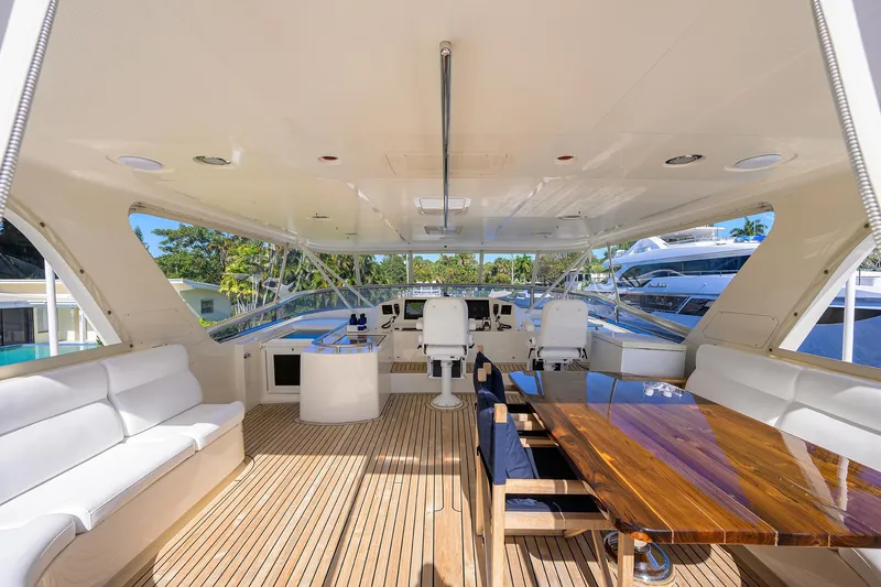 Bandol Yacht Photos Pics Luxurious 2006 Marlow 78E yacht interior with elegant seating and polished wood table.