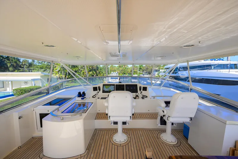 Bandol Yacht Photos Pics 2006 Marlow 78E yacht helm with dual captain chairs and navigation equipment.