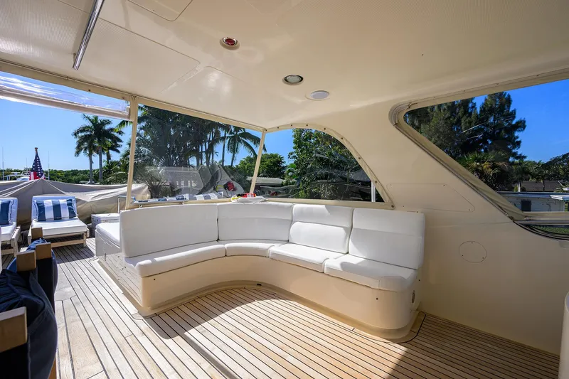 Bandol Yacht Photos Pics Luxurious 2006 Marlow 78E yacht interior with white seating and wooden deck.