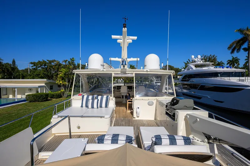 Bandol Yacht Photos Pics Luxurious 2006 Marlow 78E yacht deck with sun loungers and clear blue sky.