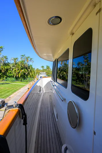 Bandol Yacht Photos Pics Side deck view of 2006 Marlow 78E yacht with teak flooring and sleek design.