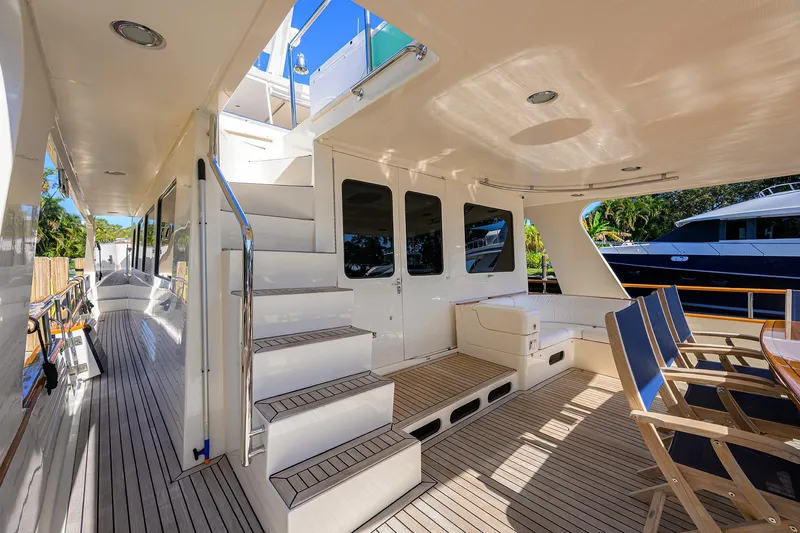 Bandol Yacht Photos Pics Spacious deck of 2006 Marlow 78E yacht with seating and stairs.