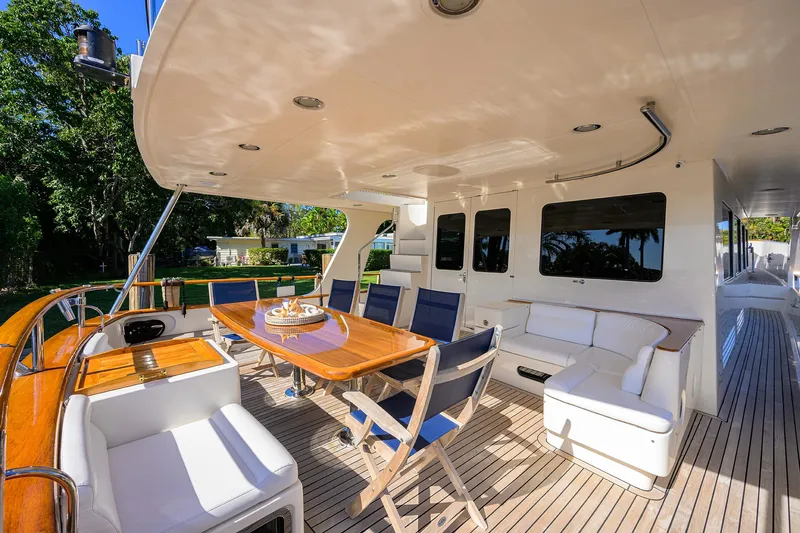 Bandol Yacht Photos Pics Luxurious 2006 Marlow 78E yacht deck with elegant seating and dining area.