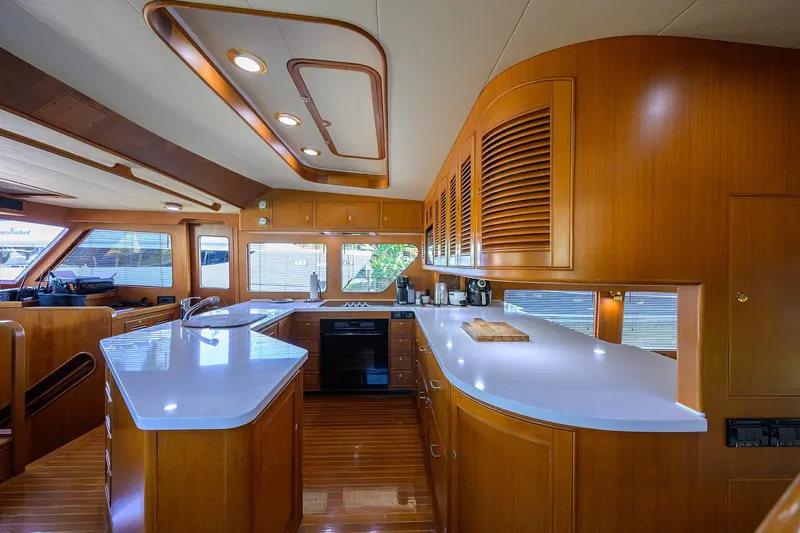 Bandol Yacht Photos Pics Luxurious Marlow 78E yacht kitchen interior with modern wood cabinetry, 2006 model.