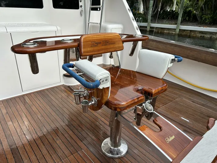 Rusty Yacht Photos Pics Luxury fishing chair on 2006 Viking 52 Convertible yacht, featuring polished wood and stainless steel.