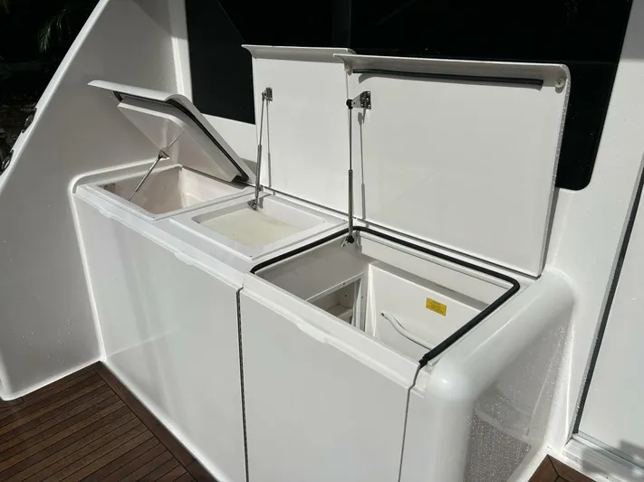 Rusty Yacht Photos Pics Open storage compartments on a 2006 Viking 52 Convertible yacht deck.