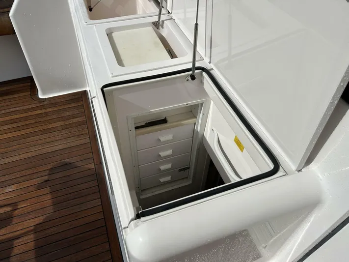 Rusty Yacht Photos Pics Storage compartment on 2006 Viking 52 Convertible yacht with wooden deck.