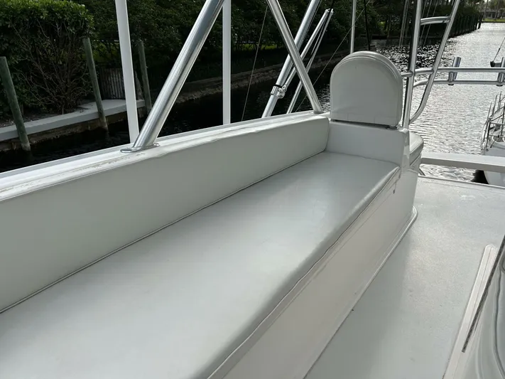 Rusty Yacht Photos Pics 2006 Viking 52 Convertible boat seating area with sleek white upholstery.