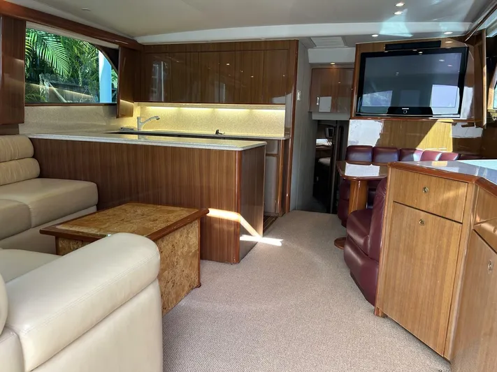 Rusty Yacht Photos Pics Luxurious interior of a 2006 Viking 52 Convertible yacht with elegant wood finishes.
