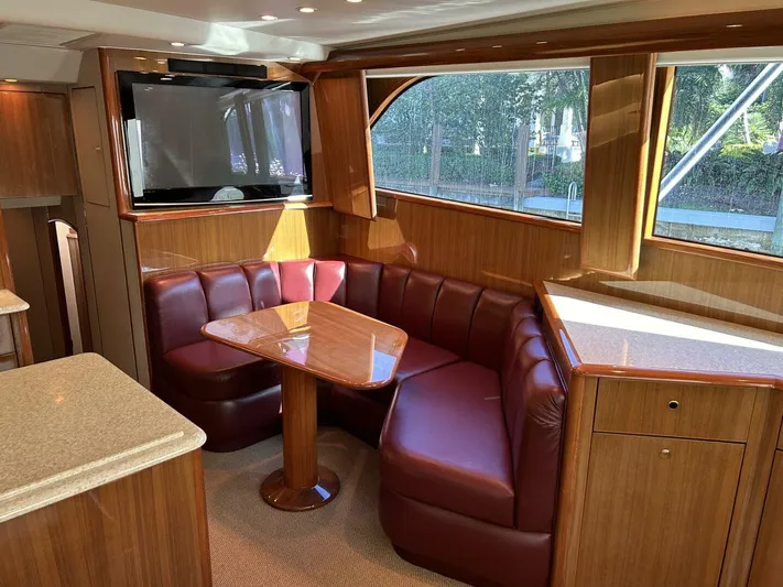 Rusty Yacht Photos Pics Luxurious interior of 2006 Viking 52 Convertible yacht with leather seating and wood finishes.