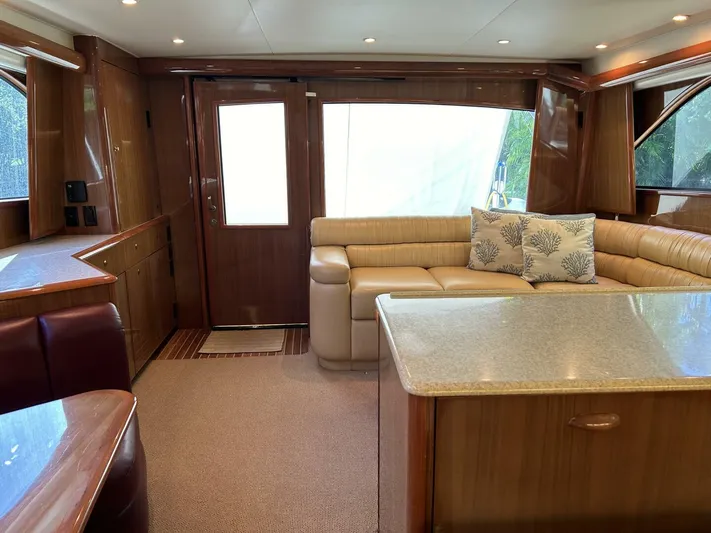 Rusty Yacht Photos Pics Luxurious interior of a 2006 Viking 52 Convertible yacht with elegant seating and wood finishes.