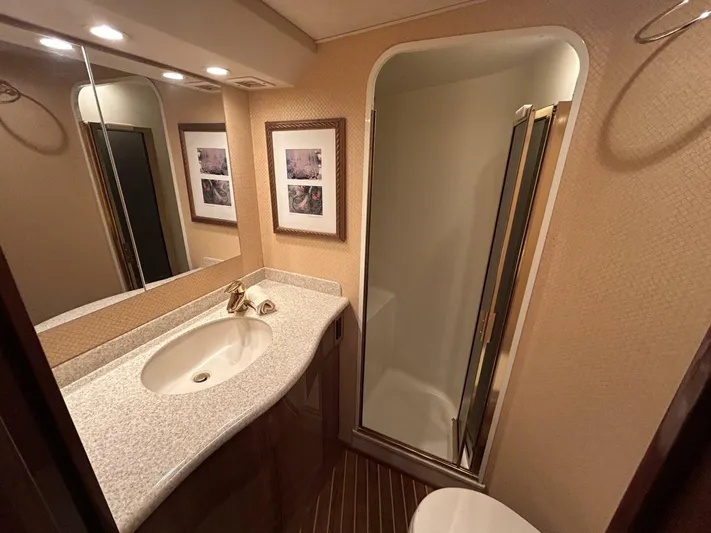 Rusty Yacht Photos Pics Luxurious bathroom interior of 2006 Viking 52 Convertible yacht with modern fixtures.