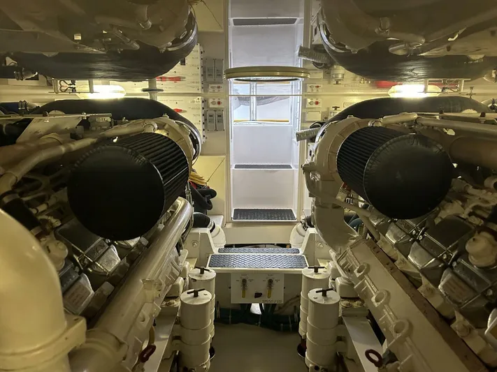 Rusty Yacht Photos Pics Engine room of a 2006 Viking 52 Convertible yacht, showcasing dual engines and control panels.