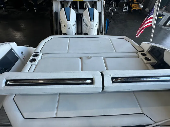  Yacht Photos Pics 2022 Cobalt R33 boat with dual engines and American flag in a marina setting.