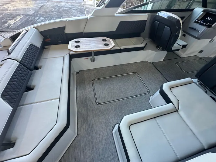  Yacht Photos Pics Luxurious interior of 2022 Cobalt R33 boat with sleek seating and modern design.